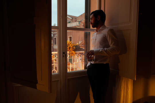 Young man drinking fine whisky