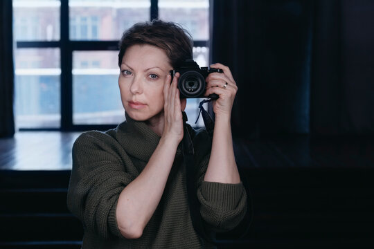 Female photographer with a camera.