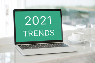 Laptop computer with 2021 trends on screen background, digital marketing, business and technology concept