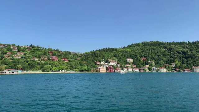Footage of Anadolu hisari / Kandilli area of Istanbul by Bosphorus. Beautiful scene. It is a sunny summer day. Camera moves forward.