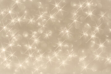 Trendy champagne colour background with bokeh orbs and stars