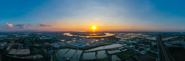 Panorama aerial view Sunset scene of gas power plant. Thermal power plants and fuel oil
