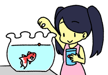金魚にエサをあげる少女