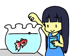 金魚にエサをあげる少女