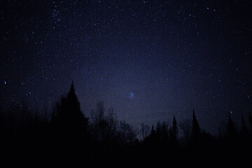 Naklejka premium Astrophotography image taken of constellation Pleiades in Ontario, Canada. Photo of the stars in the night sky during the autumn season.