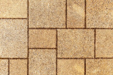 Vintage brown cobblestone pavement pattern and background