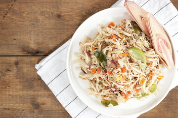 Ayam suir Kecombrang : shredded chicken spicy with kecombrang or honje or kincung fragrant edible flower. Selective focus