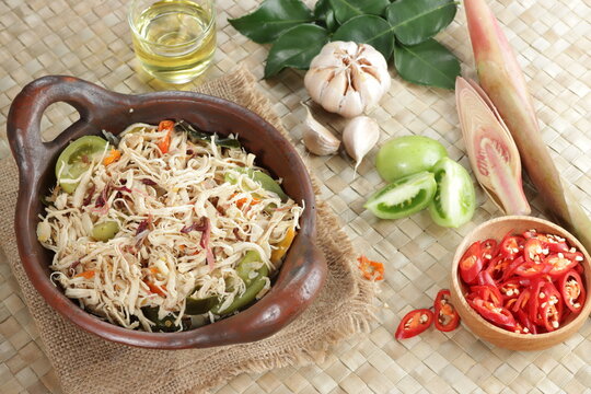 Ayam suir Kecombrang : shredded chicken spicy with kecombrang or honje or kincung fragrant edible flower. Selective focus