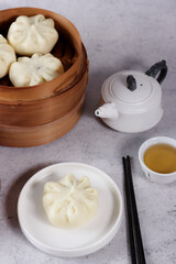 Bakpao or pao or chinese steamed bun in traditional bamboo steamer