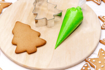 Making christmas cookies at home. Decorating cookies with fun