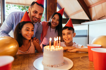 Latin family celebrating birthday party at home