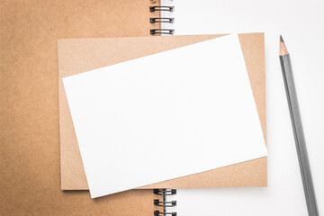 empty paper card on drawing notebook with pencil copy space for message