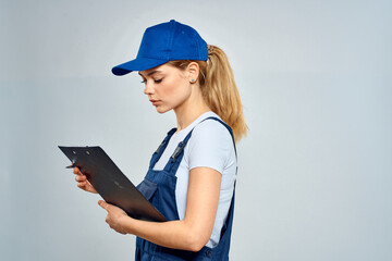 Working woman in uniform courier delivery service documents