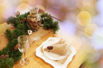 Gala dinner. Cooking at Christmas. New year's interior in the kitchen. Decorations: Christmas tree, garland, cones and glasses, gold and green