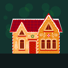 Gingerbread house on green background