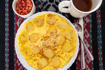 Traditional East African breakfast of Chips Mayai, a fried potato omelet, Arusha, Tanzania
