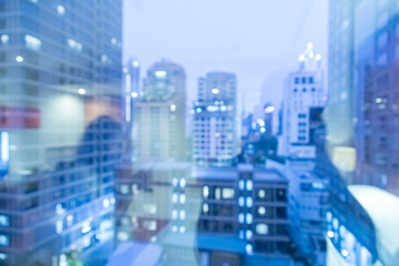 Blur image of city scape building in the night with light bokeh