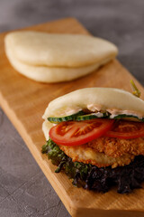 Steamed wheat bun dressed with designer sauce. Vietnamese cuisine concept. Still life. Close-up.