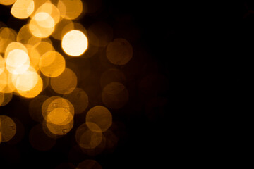 Abstract gold bokeh with black background