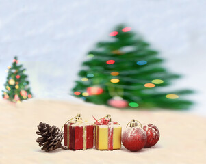 blur colorful christmas tree and bokeh lights background with gift box