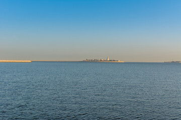 Blue sea and island with blue sky in the morning at the corniche park in Dammam, Kingdom of Saudi Arabia