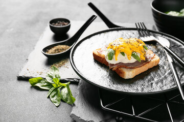 Plate with tasty egg Benedict on table
