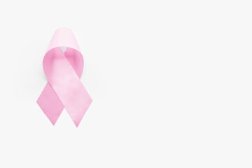 Pink ribbon on light background. Breast cancer awareness concept