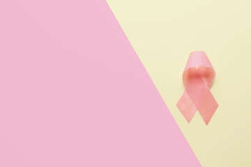 Pink ribbon on color background. Breast cancer awareness concept
