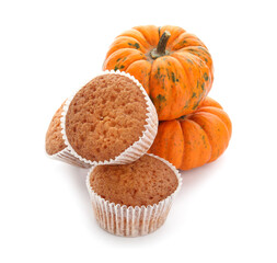 Tasty pumpkin muffins on white background