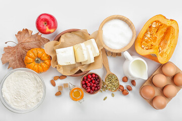 Ingredients for preparing pumpkin pie on white background