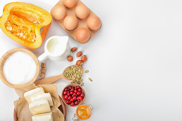 Ingredients for preparing pumpkin pie on white background