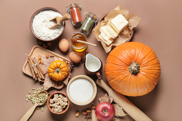 Ingredients for preparing pumpkin pie on color background
