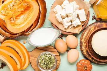 Ingredients for preparing pumpkin pie on color wooden background