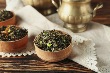Bowl with dry fruit tea on table