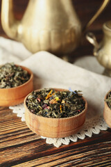 Bowl with dry fruit tea on table