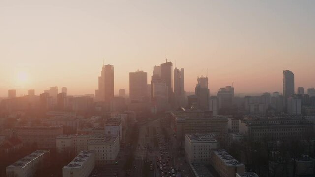 Golden sunlight during sunrise in the center of Warsaw. Drone.