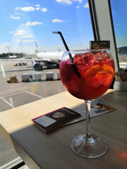 a glass of aperol at the airport before departure