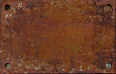 On a rough wall or floor, paint flakes off. Corrosion and rust of metal. Old dilapidated wall.