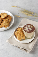 Cereal cookies with coffe on white plates