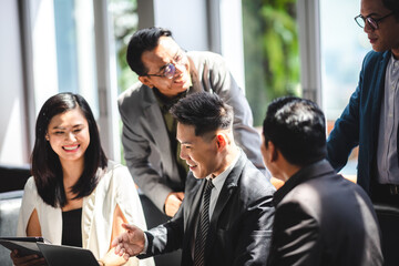 Chinese Asian Business Discussion, Business partners are discussing market strategies © chokniti