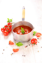 tomato sauce with fresh herbs and tomatoes in casserole
