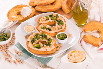 Friselle with turnip tops and hummus.