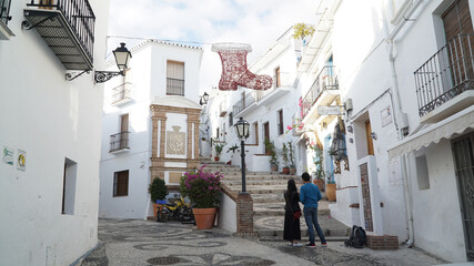Fototapeta na wymiar Nerja village architecture with white painted houses along the Costa del Sol in Spain.