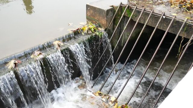 Flowing British canal metal grille grating overflow waterway dolly right