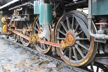 Fototapeta na wymiar The train wheel of Steam locomotive prepares to depart Start the steam generator.