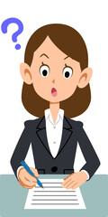 疑問の表情で書類に記入するビジネスウーマン
