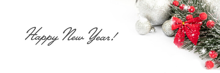 Christmas and New Year banner with toys and a red bow on a white background.