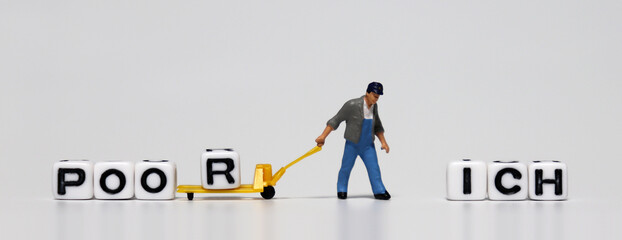 A white cube with 'R' and a miniature man pulling a cart. The concept of the rich-poor gap and...