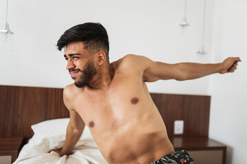 Obraz premium latin american man waking up in the morning