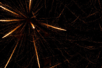 Fototapeta premium fireworks with yellow sparks on black background